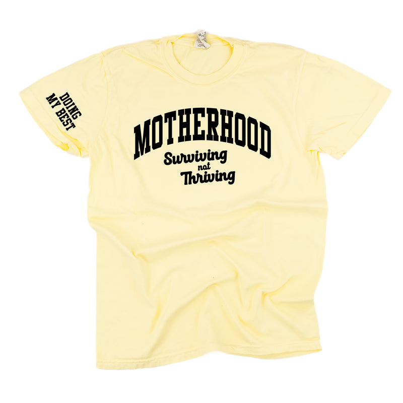 MOTHERHOOD - SURVIVING NOT THRIVING - DOING MY BEST - (Our 2024 Mantra) - Colors - LMSS® EXCLUSIVE - Short Sleeve Comfort Colors Tee