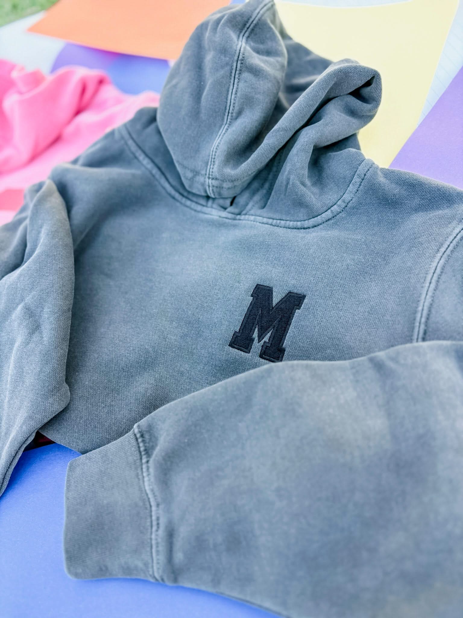 Personalized Varsity Number Youth Pigment Hoodie | Embroidered Front Letter | Printed Back Number Little Mama Shirt Shop LLC