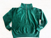 Green adult quarter zip with small flower on printed on front pocket, seen on flat lay - Little Mama Shirt Shop