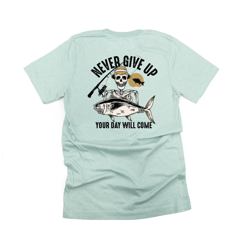 Fishing Skelly Pocket Design on Front w/ Never Give Up on Back - Unisex Tee