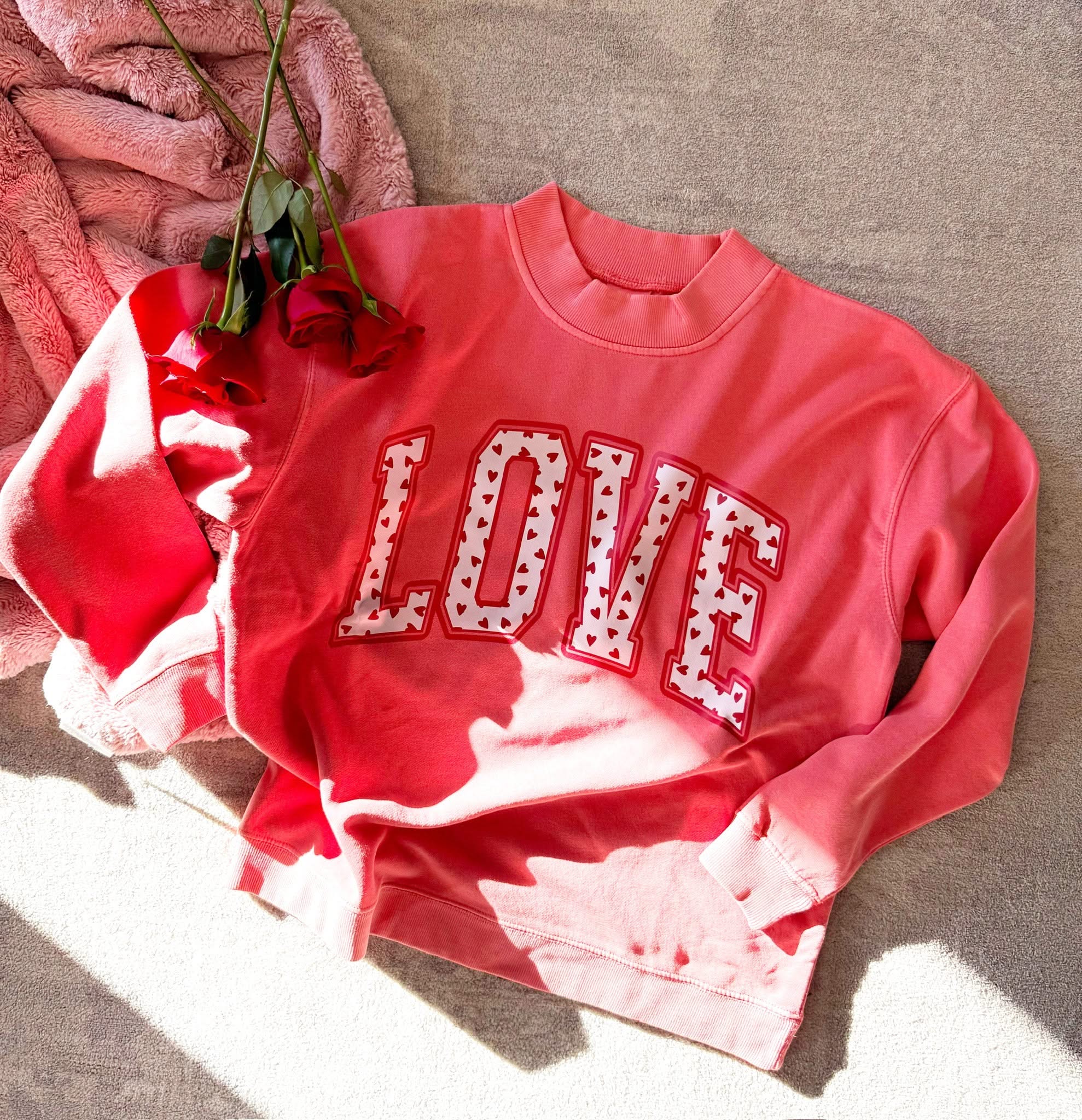 Adult mock neck in pink with "LOVE" heart design on front, shown on flat lay – Little Mama Shirt Shop