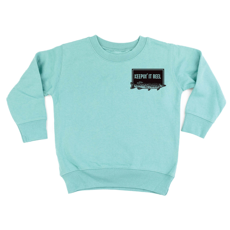 Keepin' It Reel Pocket Design on Front w/ Fishing Reel on Back - Child Sweater
