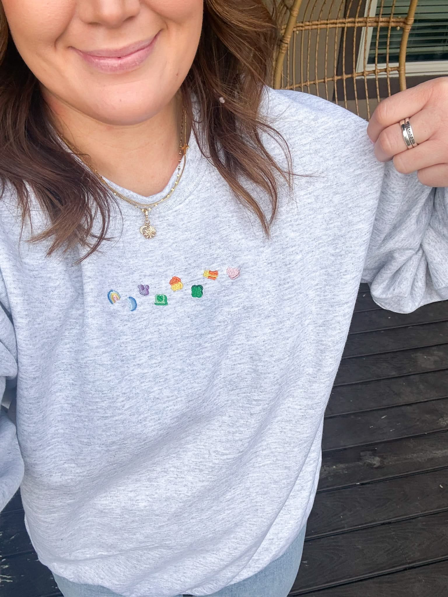 Ash adult basic fleece with lucky charm marshmallows embroidered on chest, seen on model - Little Mama Shirt Shop