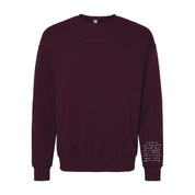 Maroon crewneck with "Permission To Be Optimistic" on chest and permission to be paragraph printed on sleeve, shown on flat lay - Little Mama Shirt Shop