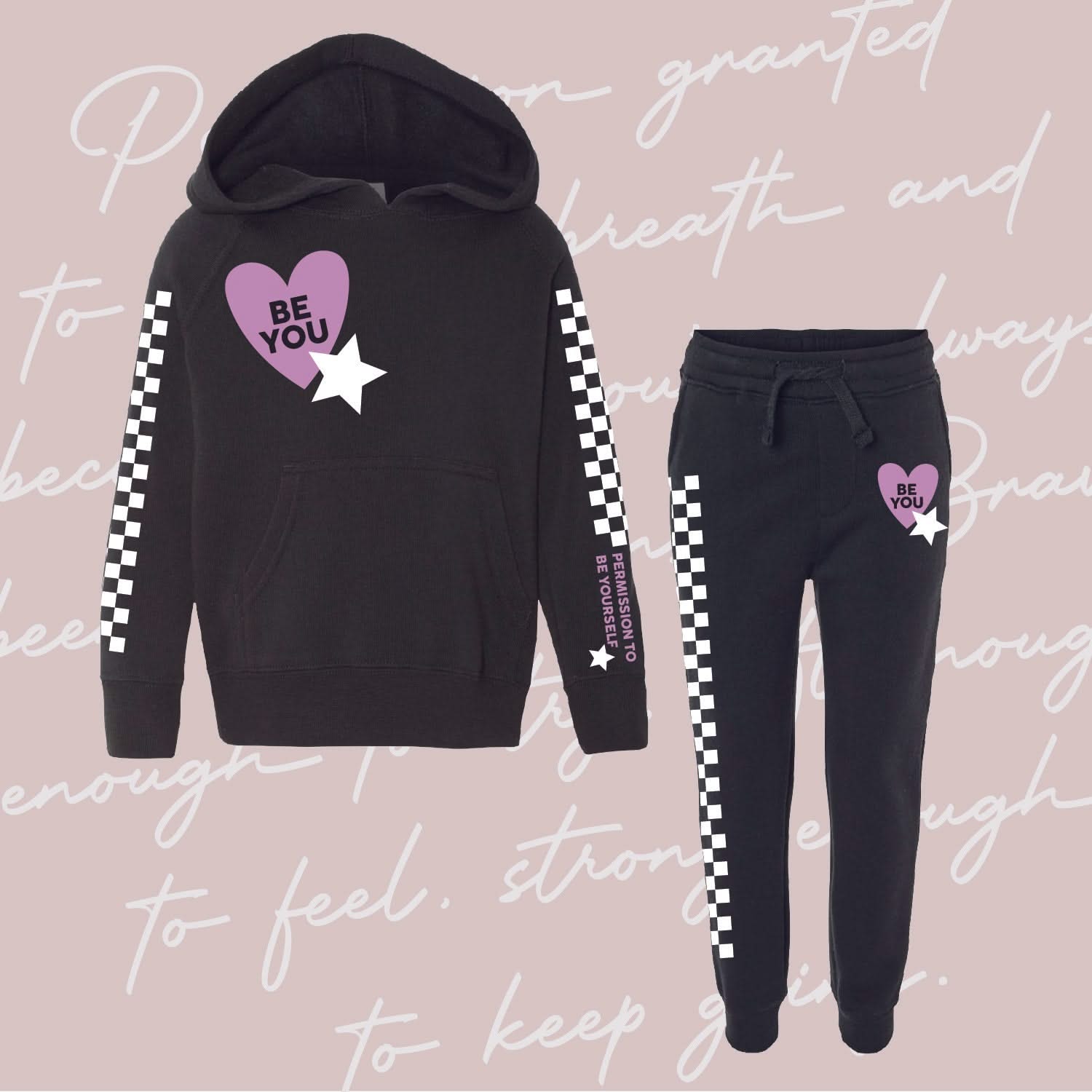 Child black sweater and joggers with checkers pattern on arm and leg, and Purple Heart with 'be you' in it flanked by a white star, seen on flat lay - Little Mama Shirt Shop