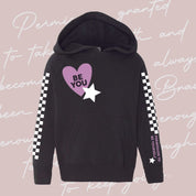 Child black sweater with checkers pattern on arm and Purple Heart with 'be you' in it flanked by a white star, seen on flat lay - Little Mama Shirt Shop