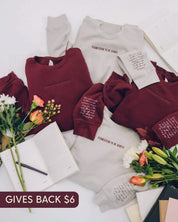 Maroon and dust crewnecks with "Permission To Be (Choose Your Word)" on chest and permission to be paragraph on sleeve, shown on flat lay - Little Mama Shirt Shop