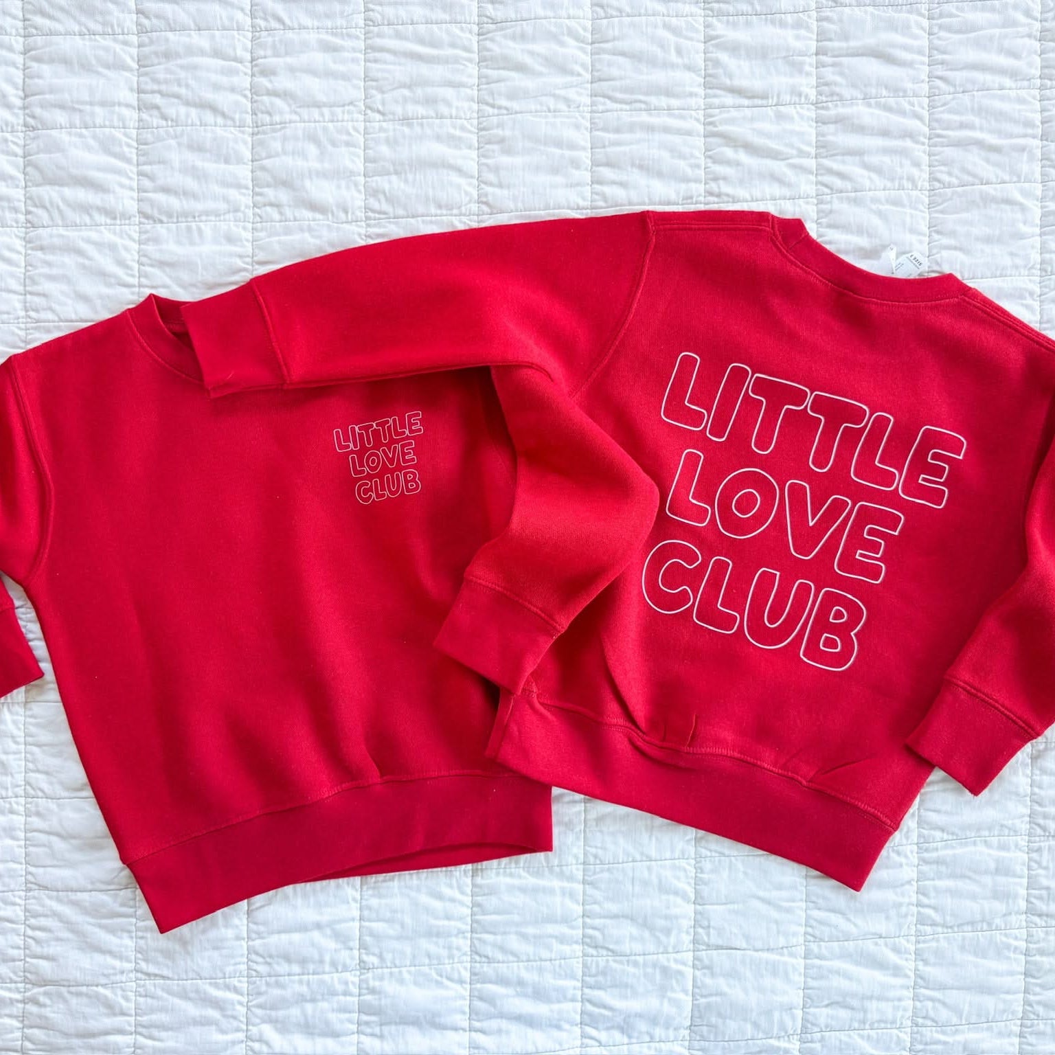 Child sweater in red with "Little Love Club" bubble letter text design on back and front left chest small, shown on flat lay – Little Mama Shirt Shop
