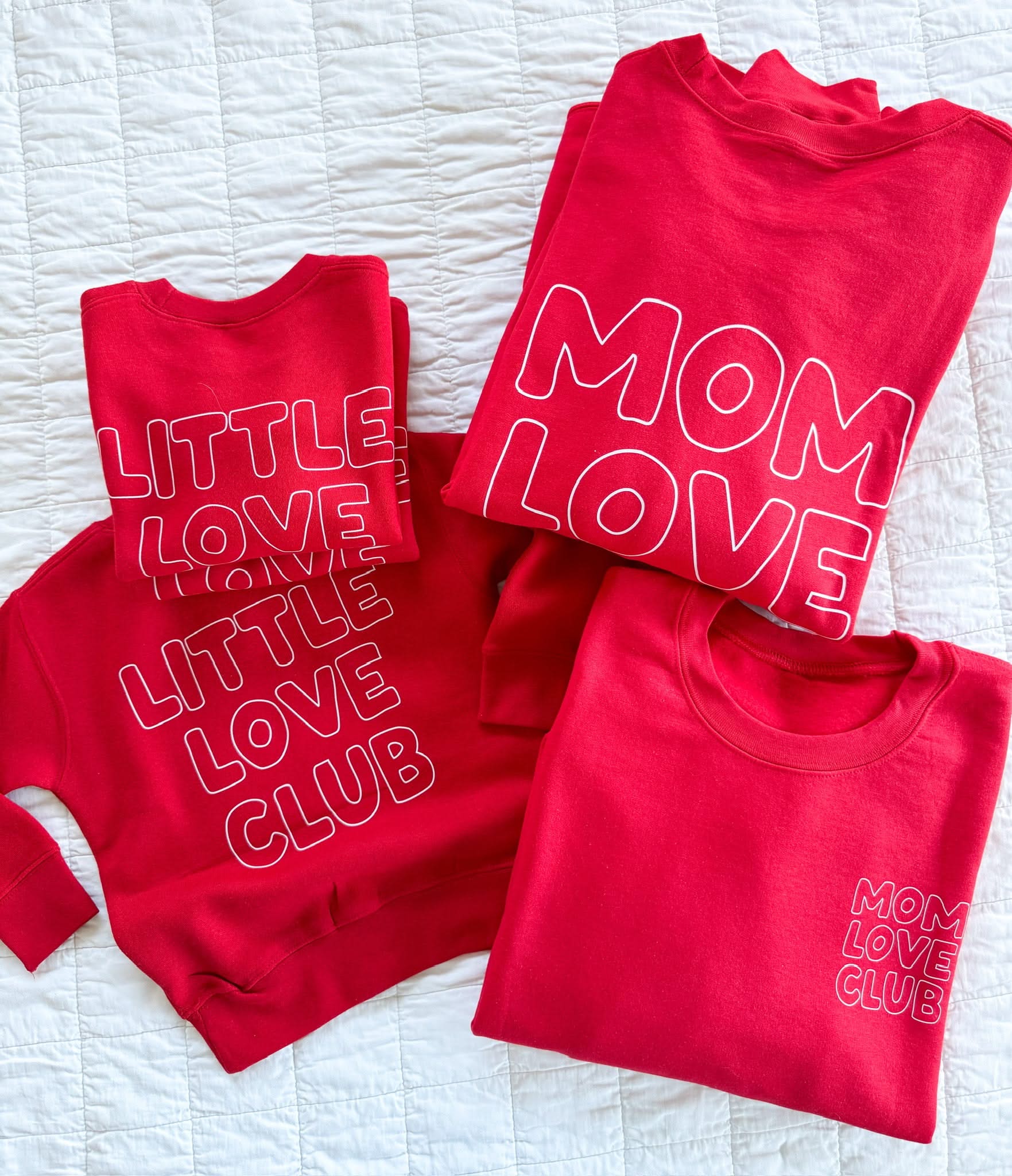 Adult and Child sweater in red with "Little Love Club" and "Mom Love Club" bubble letter text design on front left chest and back, shown on flat lay – Little Mama Shirt Shop