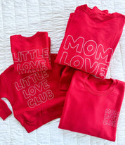 Adult and Child sweater in red with "Little Love Club" and "Mom Love Club" bubble letter text design on front left chest and back, shown on flat lay – Little Mama Shirt Shop