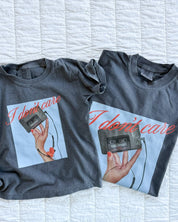 Adult and child tee with "I Don't Care" retro cassette on front and "JK I Actually Do" text on sleeve, shown on flat lay  – Little Mama Shirt Shop