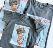 Adult and child tee with "I Don't Care" retro cassette on front and "JK I Actually Do" text on sleeve, shown on flat lay  – Little Mama Shirt Shop