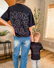 Adult and Child tee in black with "Little Love Club" and "Mom Love Club" bubble letter text design on back, shown on model – Little Mama Shirt Shop
