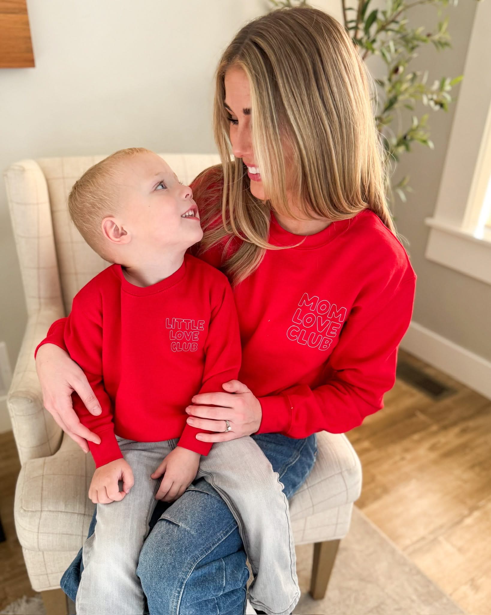 Adult and Child sweater in red with "Little Love Club" and "Mom Love Club" bubble letter text design on front left chest, shown on model – Little Mama Shirt Shop