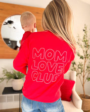 Adult  sweater in red with  "Mom Love Club" bubble letter text design on back, shown on model – Little Mama Shirt Shop