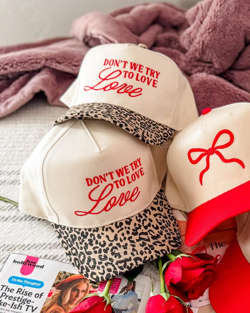 Adult cream and leopard hat with "Don't We Try To Love Love" design embroidered on front, shown on flat lay – Little Mama Shirt Shop