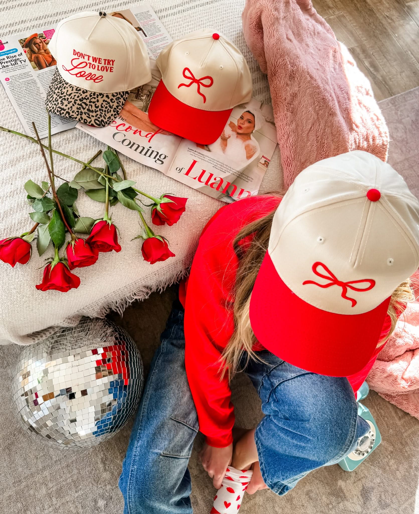 Adult cream and red hat with Red Puff Bow Embroidery on front, shown on model – Little Mama Shirt Shop