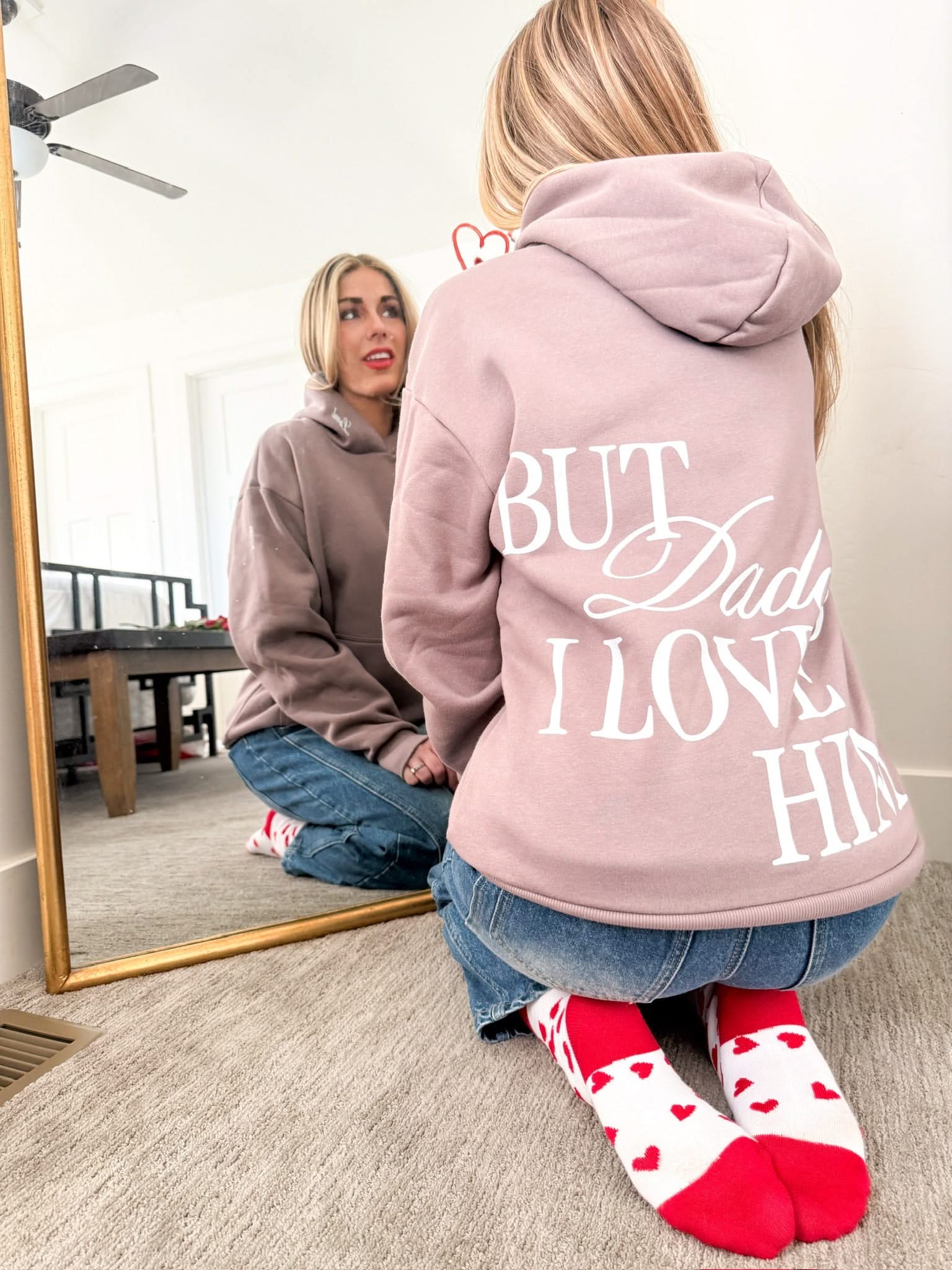 Adult hoodie in brown with "But Daddy I Love Him" design on back and "loml" script on hood, shown on model – Little Mama Shirt Shop