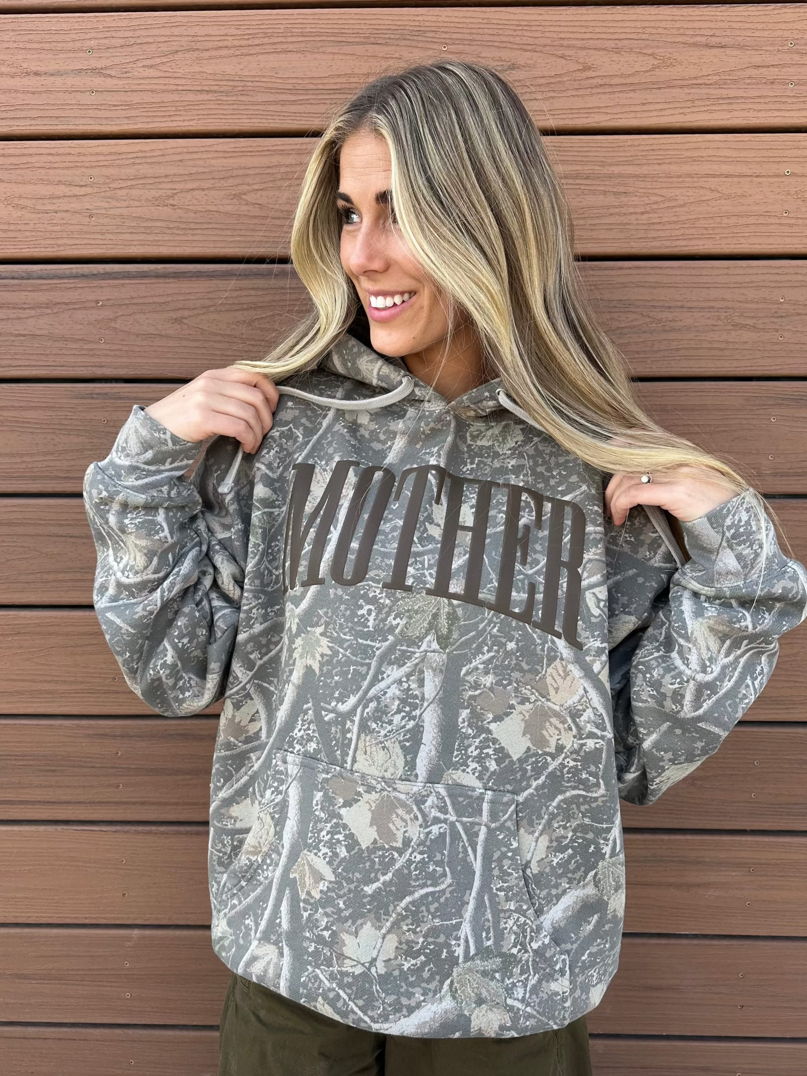 Hoodie in camo with puff print 'mother' on chest, shown on model – Little Mama Shirt Shop