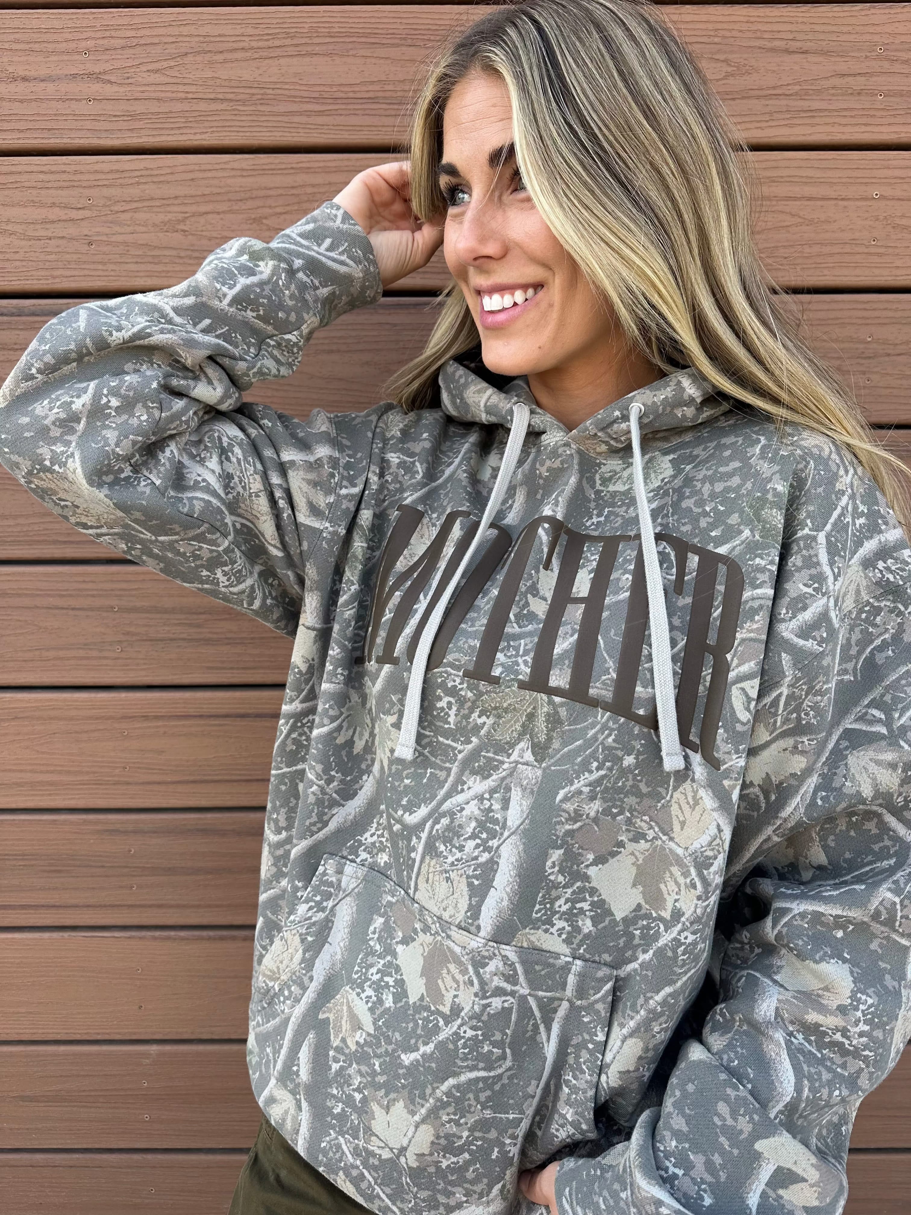 Hoodie in camo with puff print 'mother' on chest, shown on model – Little Mama Shirt Shop