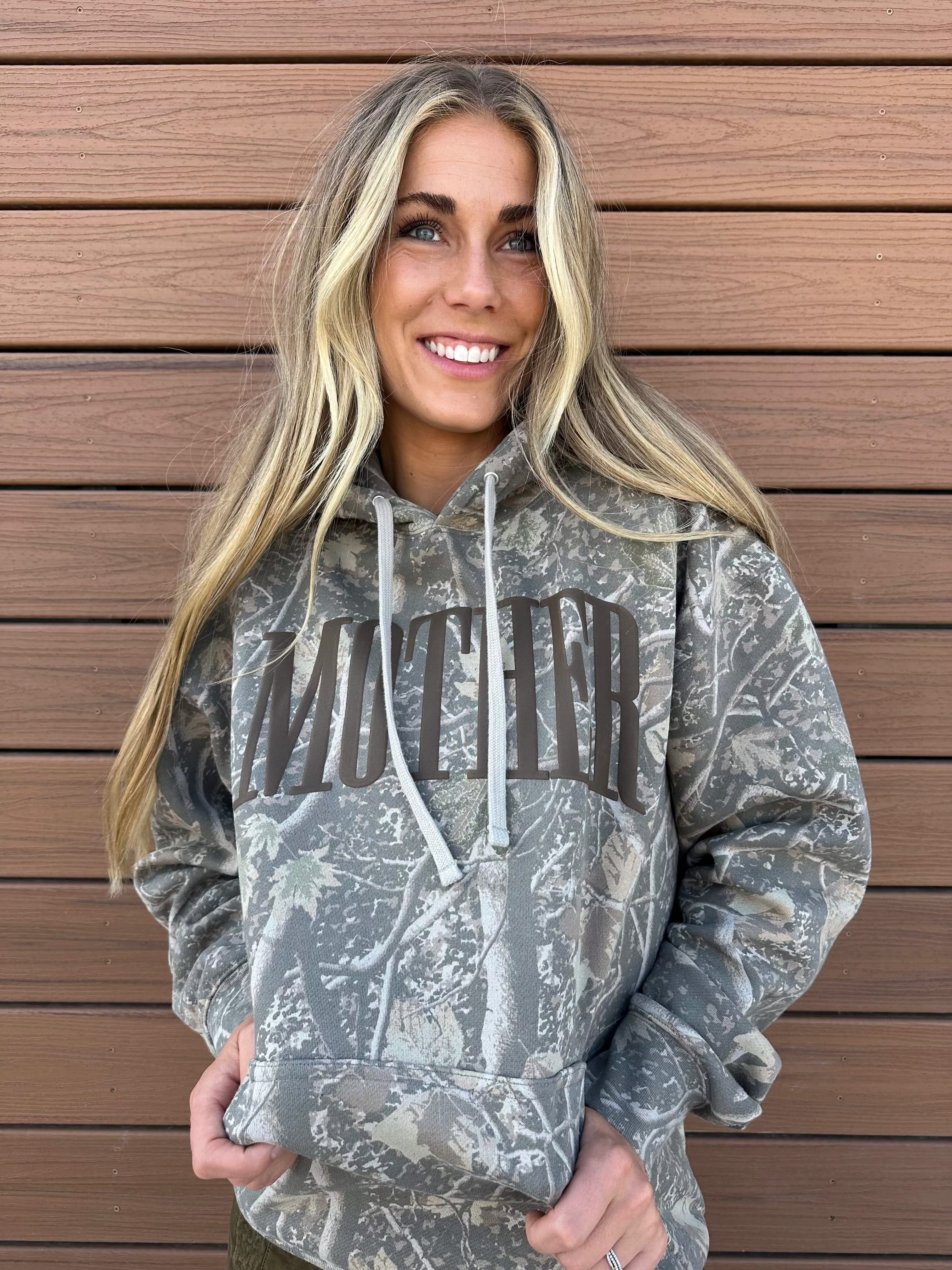 Hoodie in camo with puff print 'mother' on chest, shown on model – Little Mama Shirt Shop