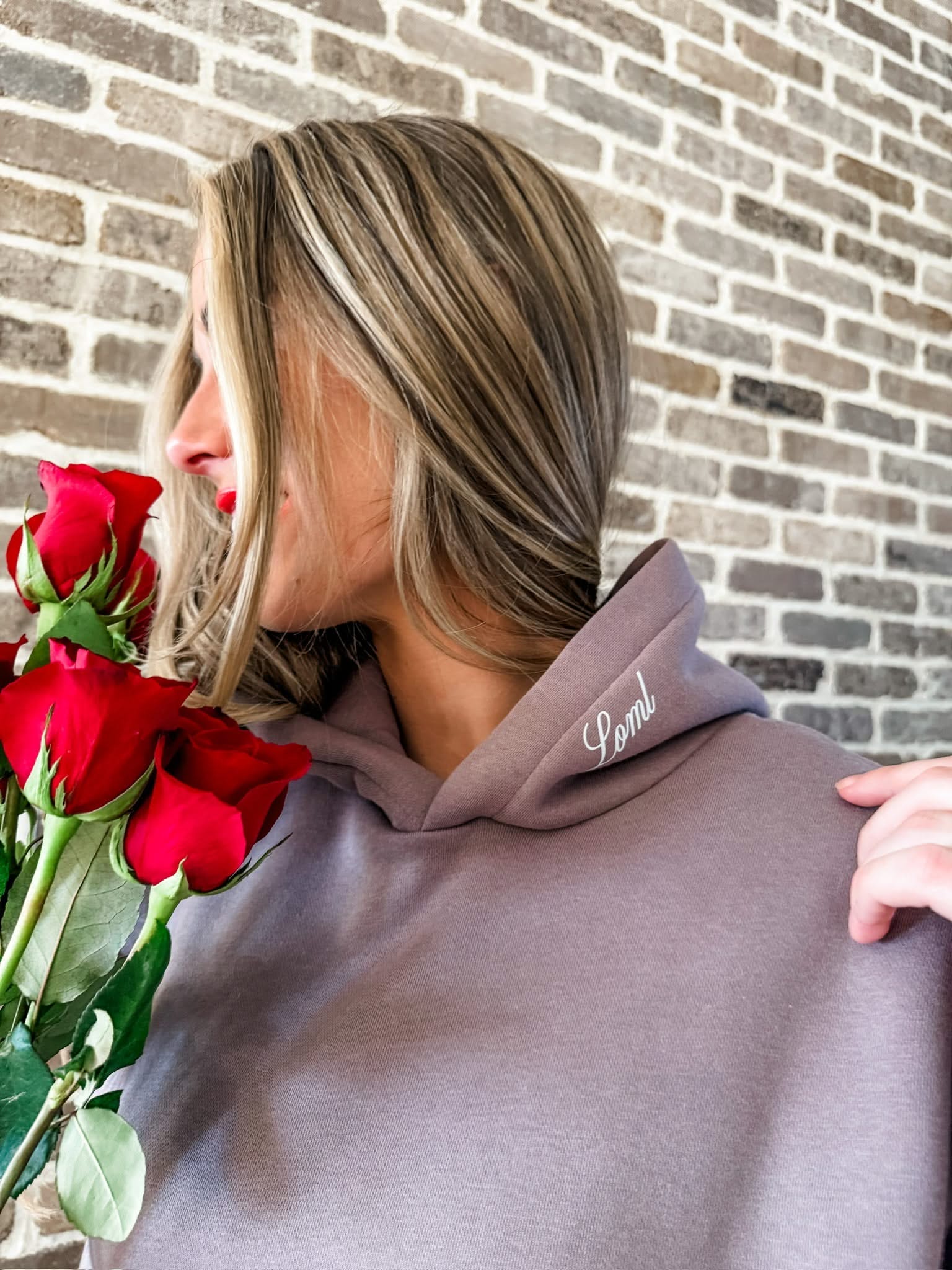 Adult hoodie in brown with "Loml" script on hood, shown on model – Little Mama Shirt Shop