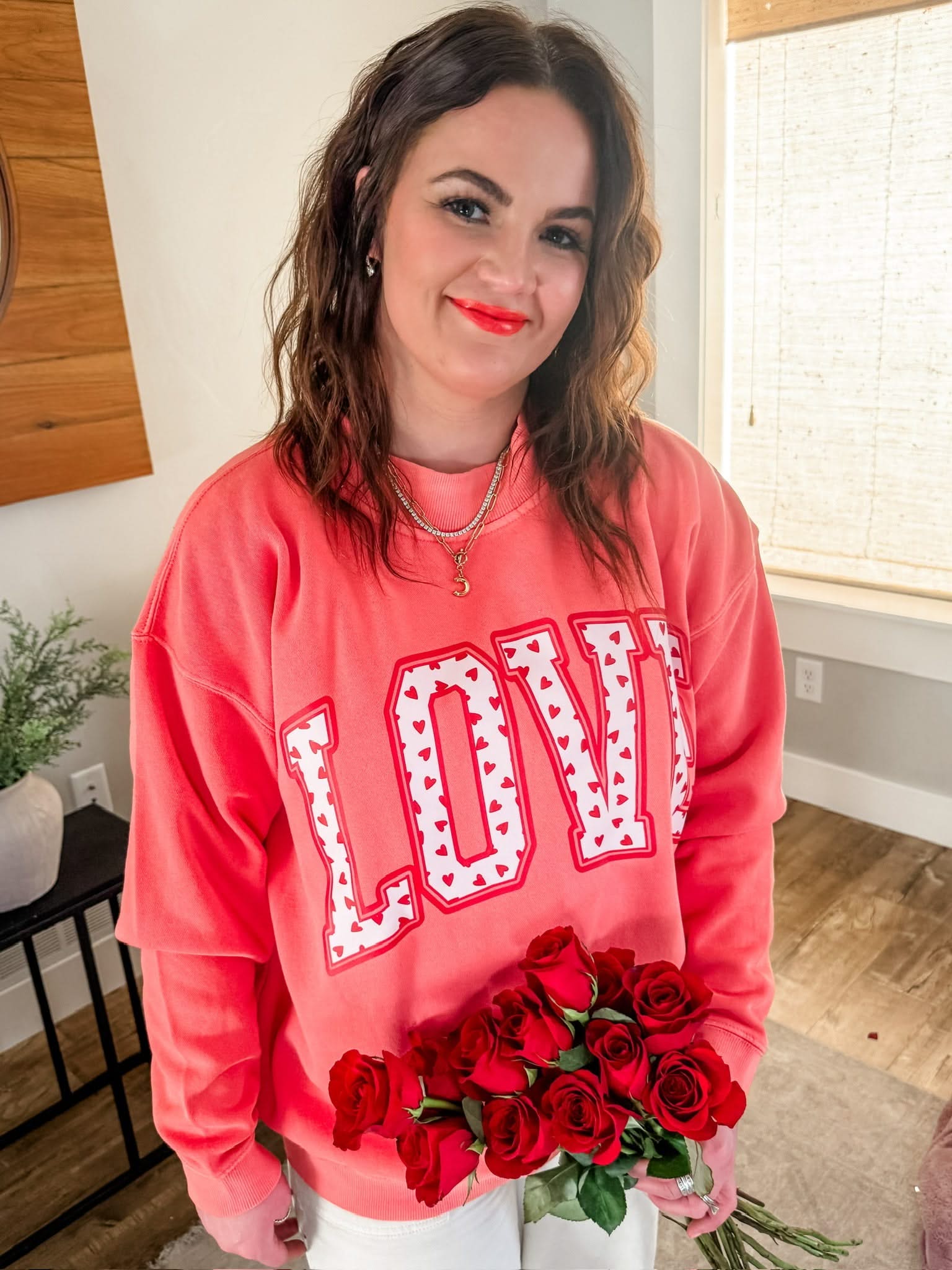 Adult mock neck in pink with "LOVE" heart design on front, shown on model – Little Mama Shirt Shop