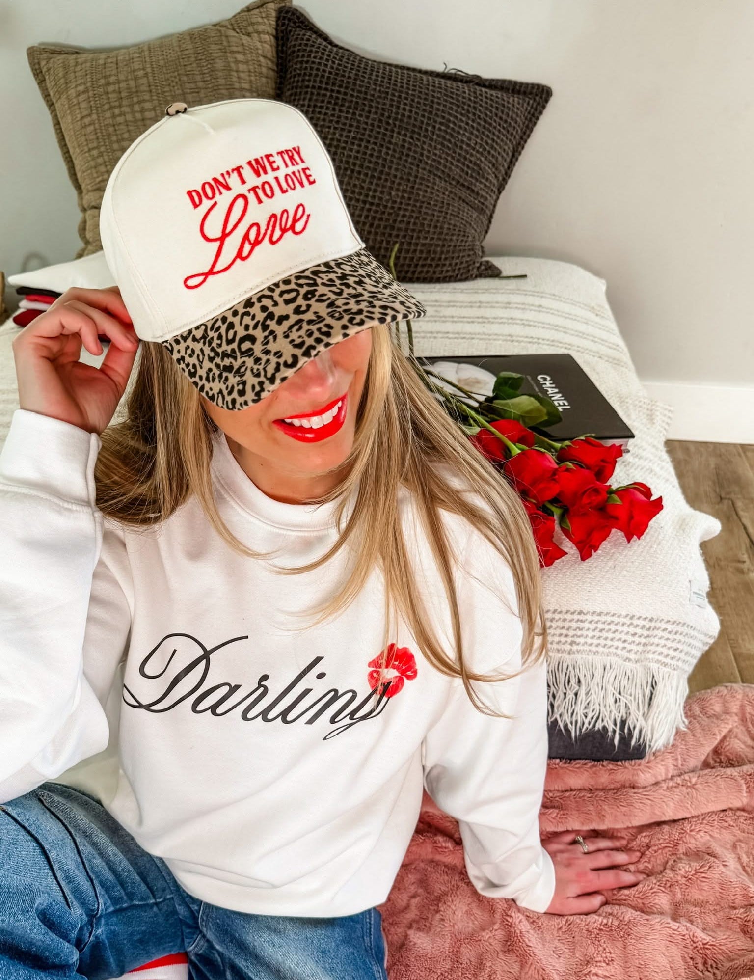 Adult cream and leopard hat with "Don't We Try To Love Love" design embroidered on front, shown on model – Little Mama Shirt Shop