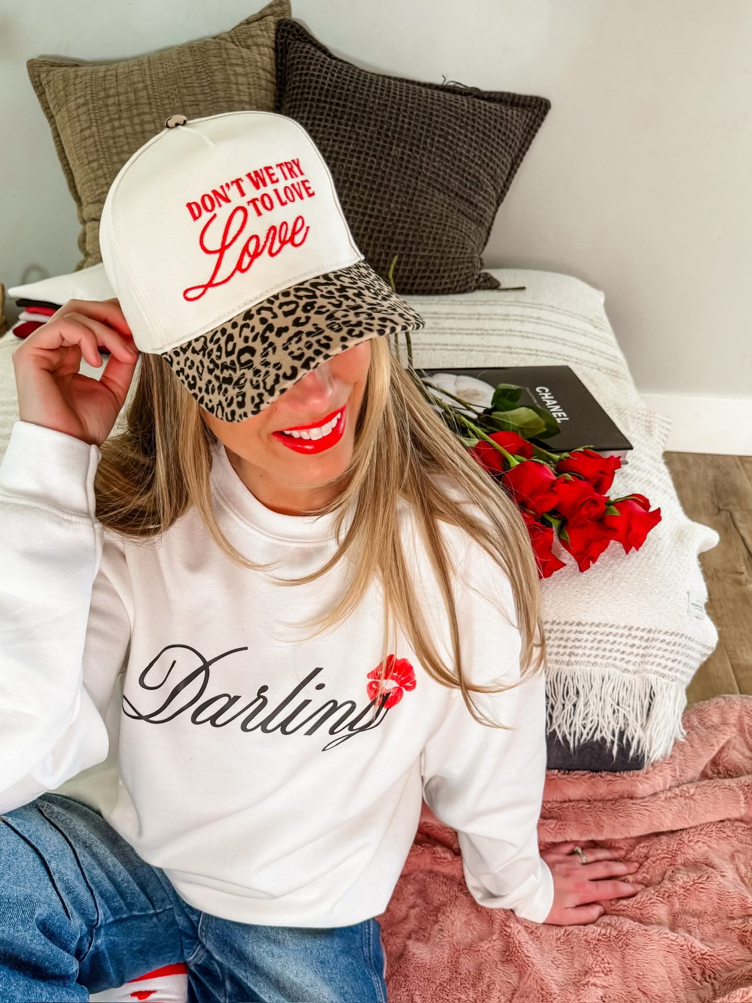 Adult cream and leopard hat with "Don't We Try To Love Love" design embroidered on front, shown on model – Little Mama Shirt Shop