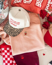 Adult pink sweater with valentine's teddy Embroidery on front, shown on flat lay  – Little Mama Shirt Shop