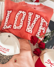 Adult mock neck in pink with "LOVE" heart design on front, shown on flat lay – Little Mama Shirt Shop