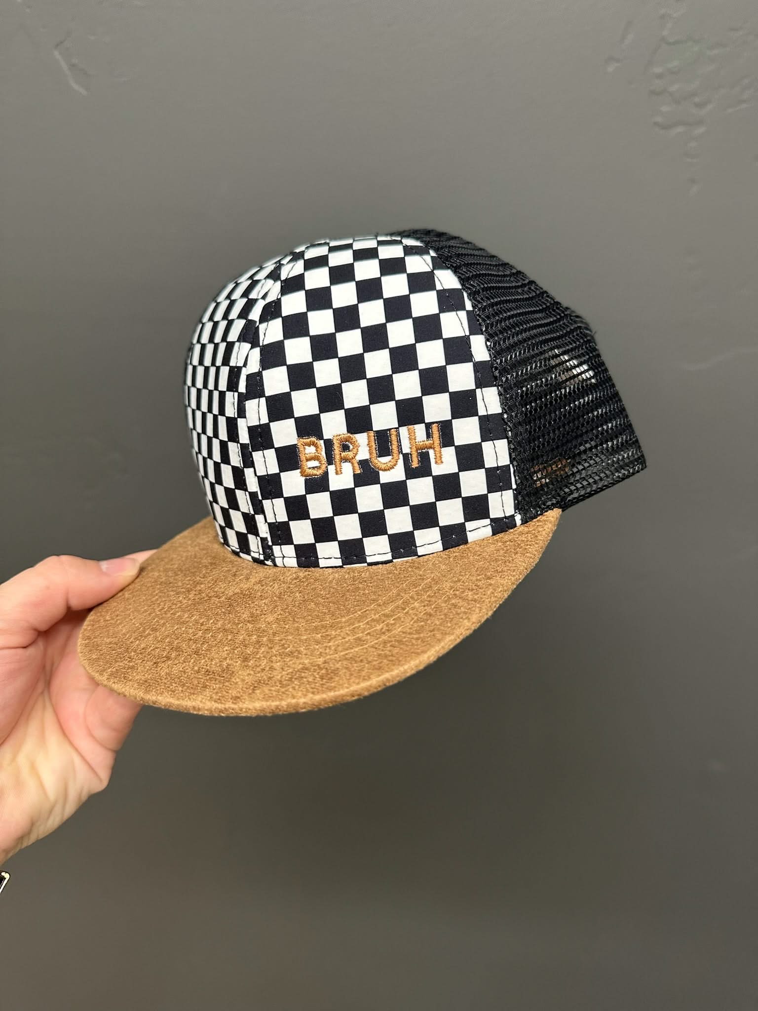 Child hat in brown and checkered with "Bruh" embroidered design, seen on up close photo - Little Mama Shirt Shop