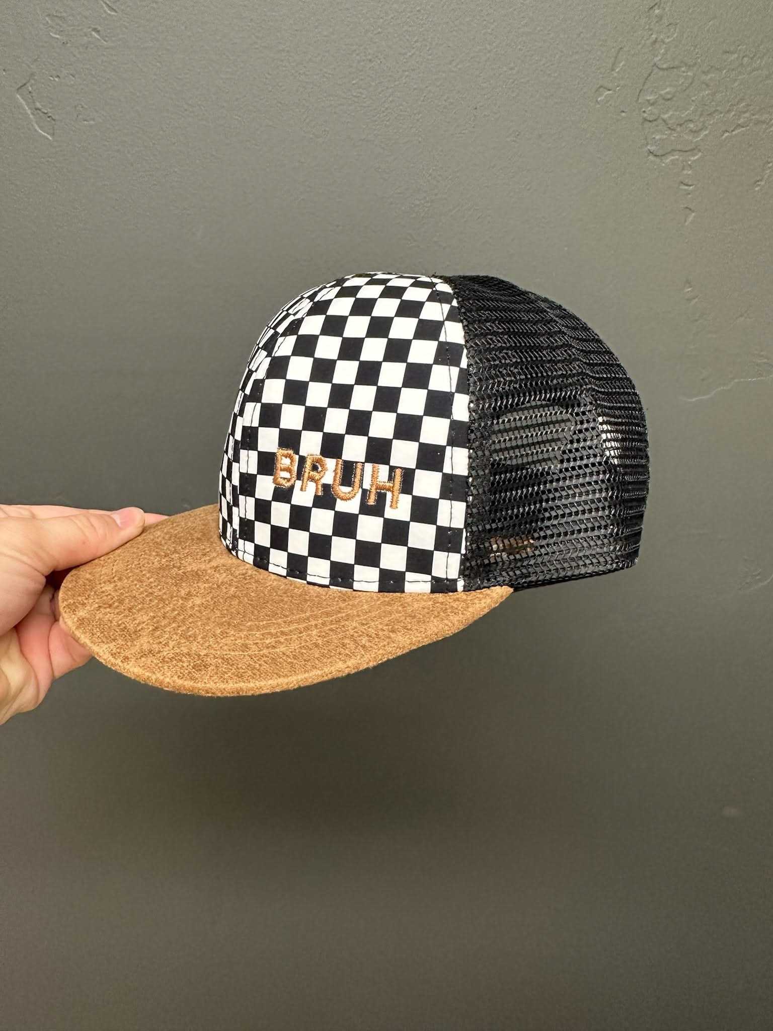 Child hat in brown and checkered with "Bruh" embroidered design, seen on up close photo - Little Mama Shirt Shop