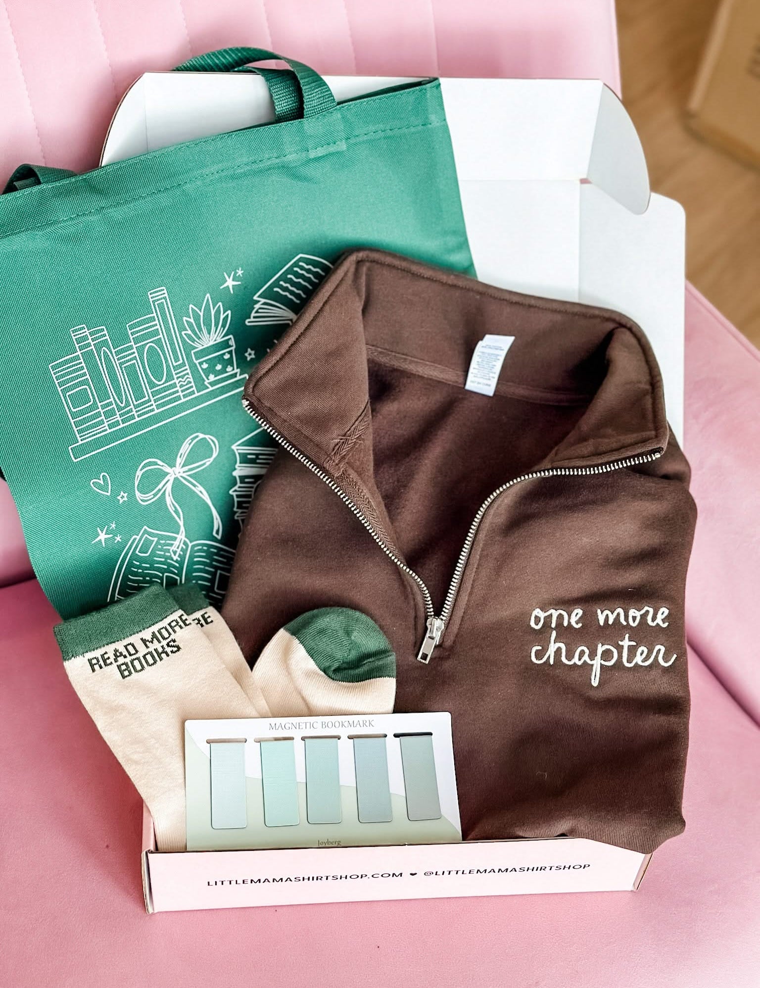 Book lover gift box with green tote, brown folded quarter zip, green 'read more books' socks, and green bookmarks shown in flat lay – Little Mama Shirt Shop