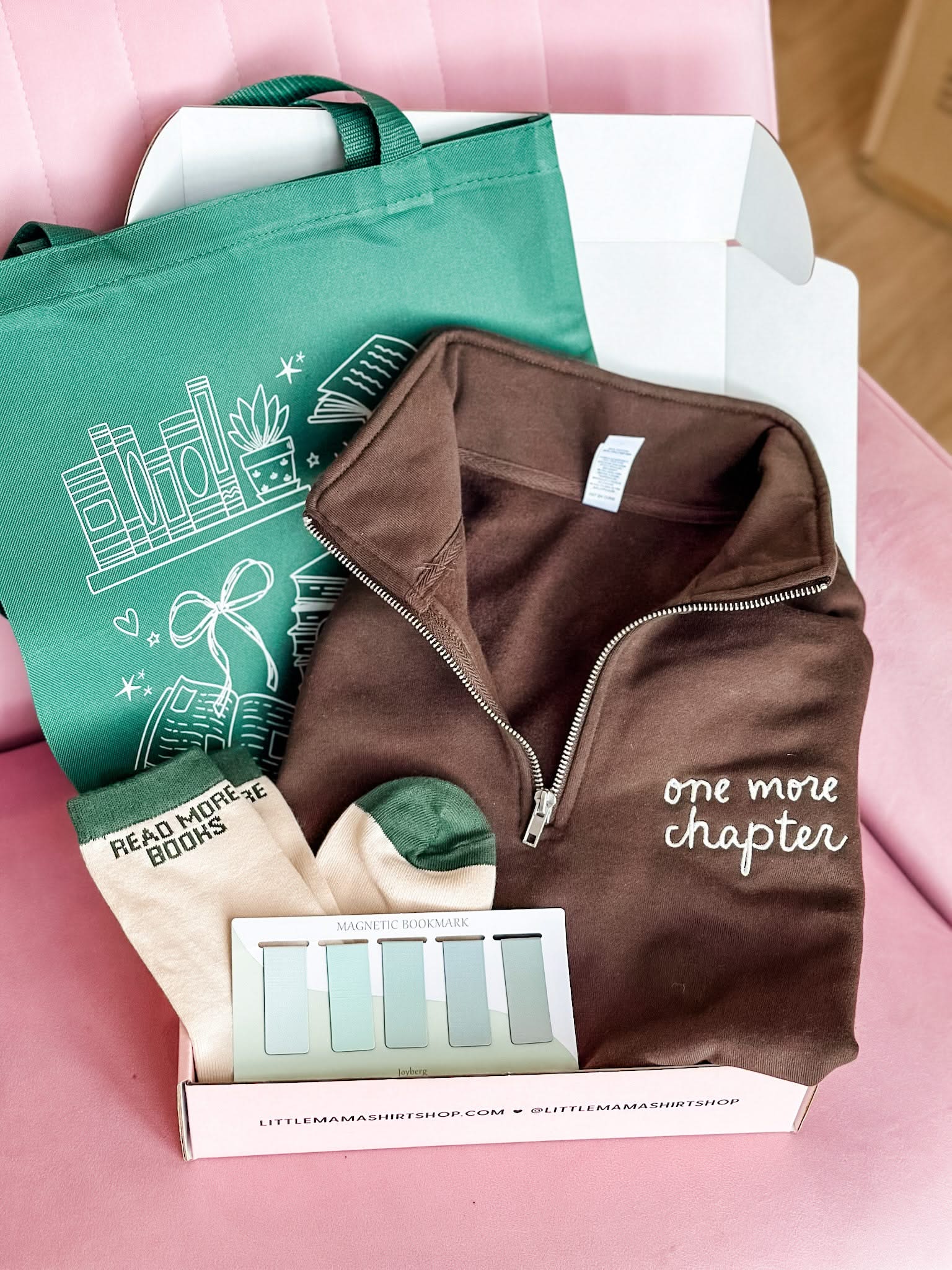 Book lover gift box with green tote, brown folded quarter zip, green 'read more books' socks, and green bookmarks shown in flat lay – Little Mama Shirt Shop