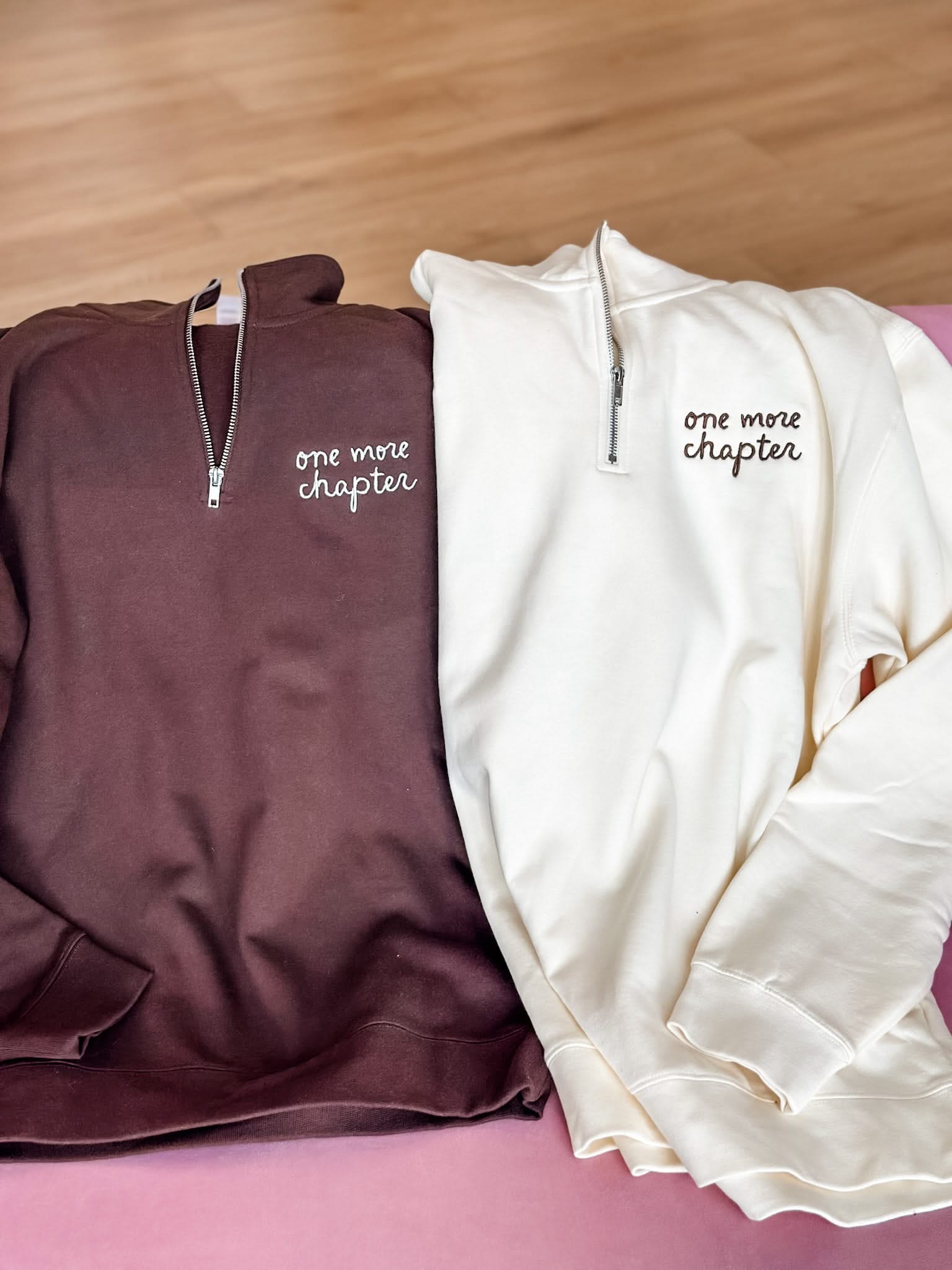 'one more chapter' book quarter zips in brown and bone folded shown on flat lay – Little Mama Shirt Shop