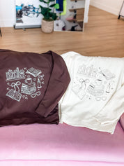 'one more chapter' book quarter zips in brown and bone folded shown on flat lay – Little Mama Shirt Shop