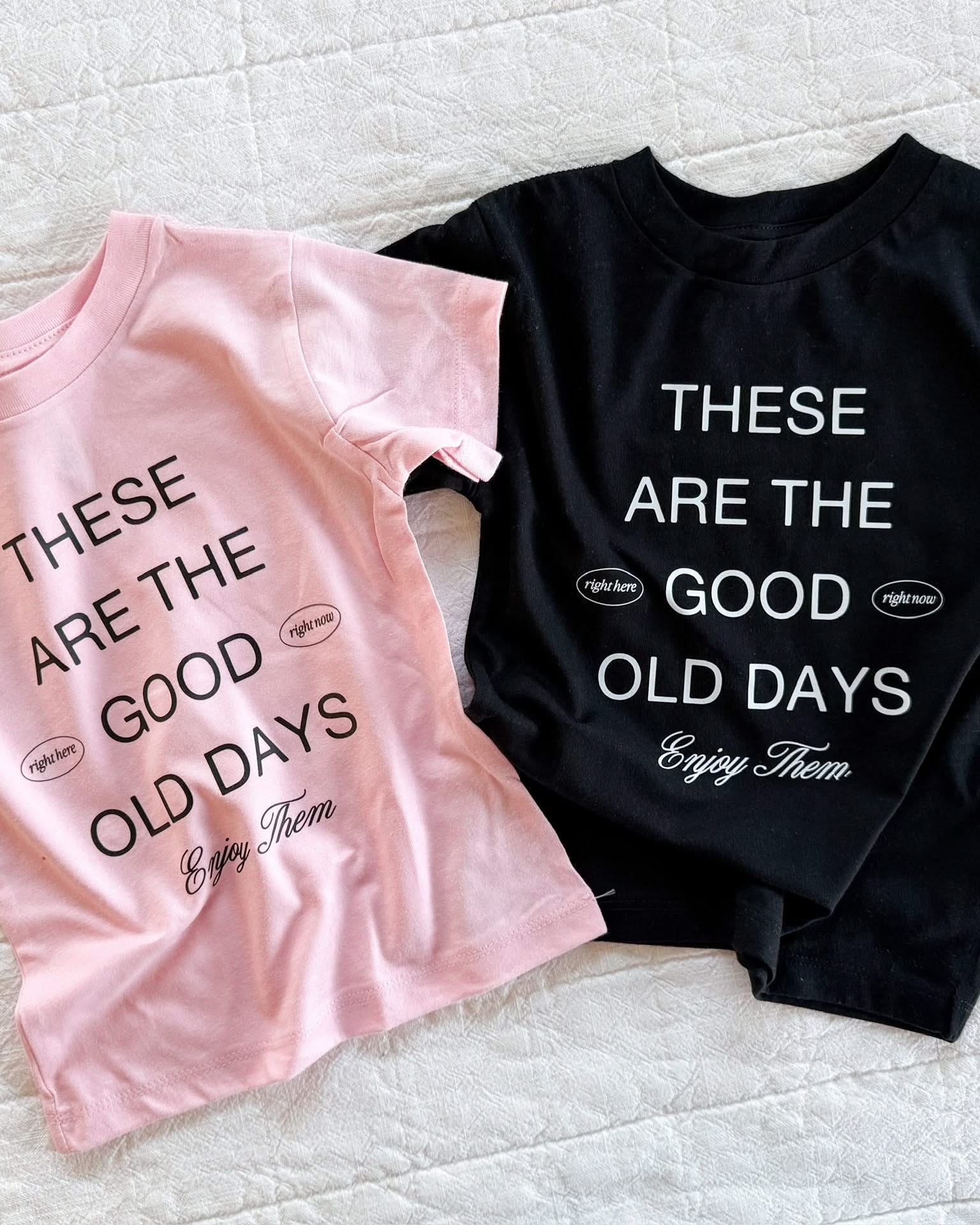 Child tees in pink and black with 'these are the good old days'  printed on the front, seen on flat lay - Little Mama Shirt Shop