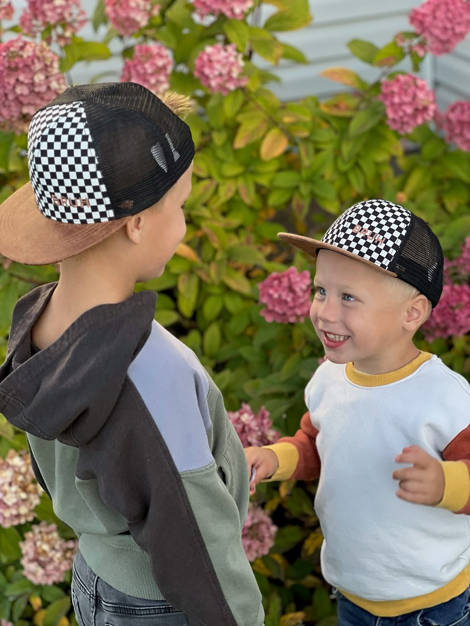 Child hat in brown and checkered with "Bruh" embroidered design, seen on models - Little Mama Shirt Shop