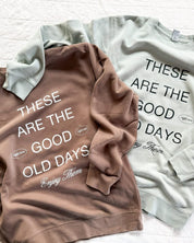 Adult pigment crewneck in brown and sage with 'these are the good old days'  printed on the front, seen on flat lay - Little Mama Shirt Shop