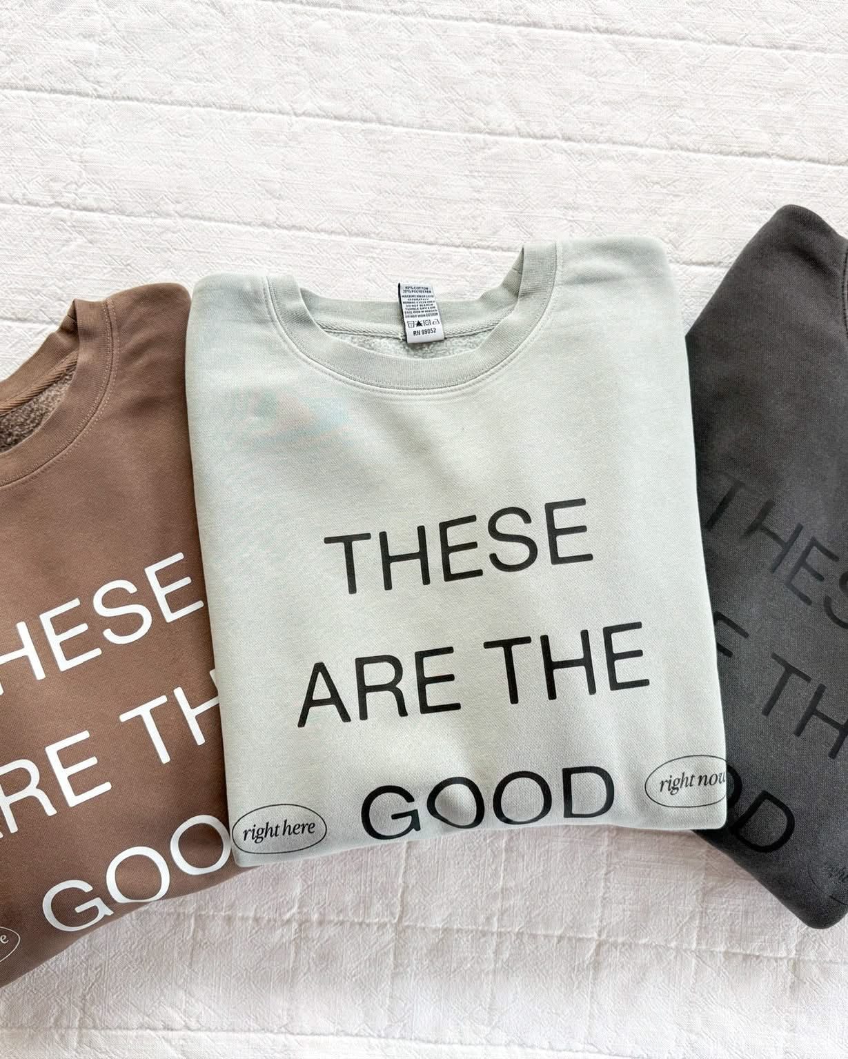 Adult pigment crewneck in brown, sage, and black with 'these are the good old days'  printed on the front, seen on flat lay - Little Mama Shirt Shop