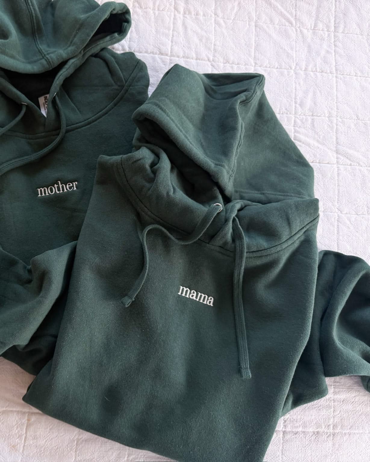 Adult alpine hoodie with mama or mother embroidered on the chest, seen on flat lay - Little Mama Shirt Shop