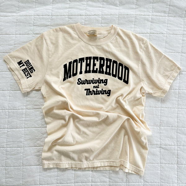 MOTHERHOOD - SURVIVING NOT THRIVING - DOING MY BEST - (Our 2024 Mantra) - Neutrals - LMSS® EXCLUSIVE - Short Sleeve Comfort Colors Tee
