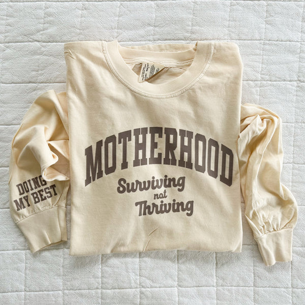 MOTHERHOOD - SURVIVING NOT THRIVING - DOING MY BEST - (Our 2024 Mantra) - Neutrals - LMSS® EXCLUSIVE - Long Sleeve Comfort Colors Tee