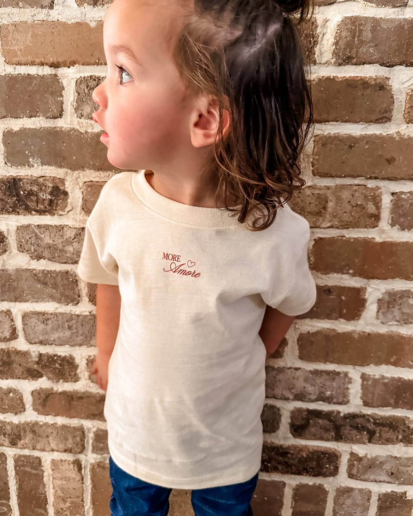 Child tee in natural with "More Amore" print on front, shown on model– Little Mama Shirt Shop