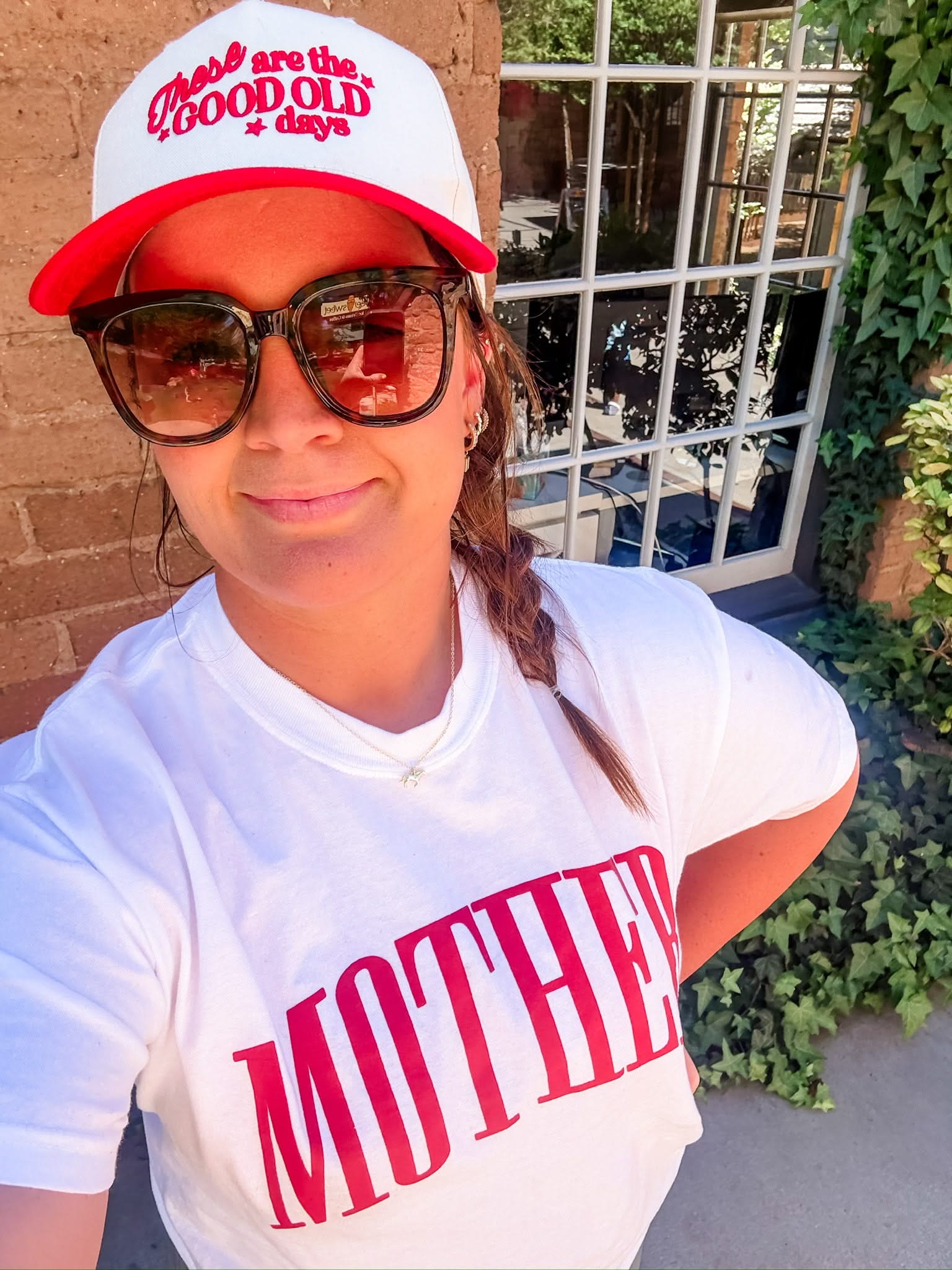 White adult comfort colors tee with red 'mother' puff print across the front, seen on model - Little Mama Shirt Shop