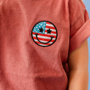 Embroidered YOUTH Comfort Colors Tee - Star Eye Smiley Flag (pocket) Little Mama Shirt Shop