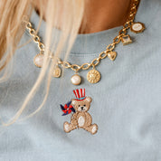 Embroidered Women's Heavyweight Tee - Teddy with Patriotic Top Hat and Pinwheel (center) Little Mama Shirt Shop