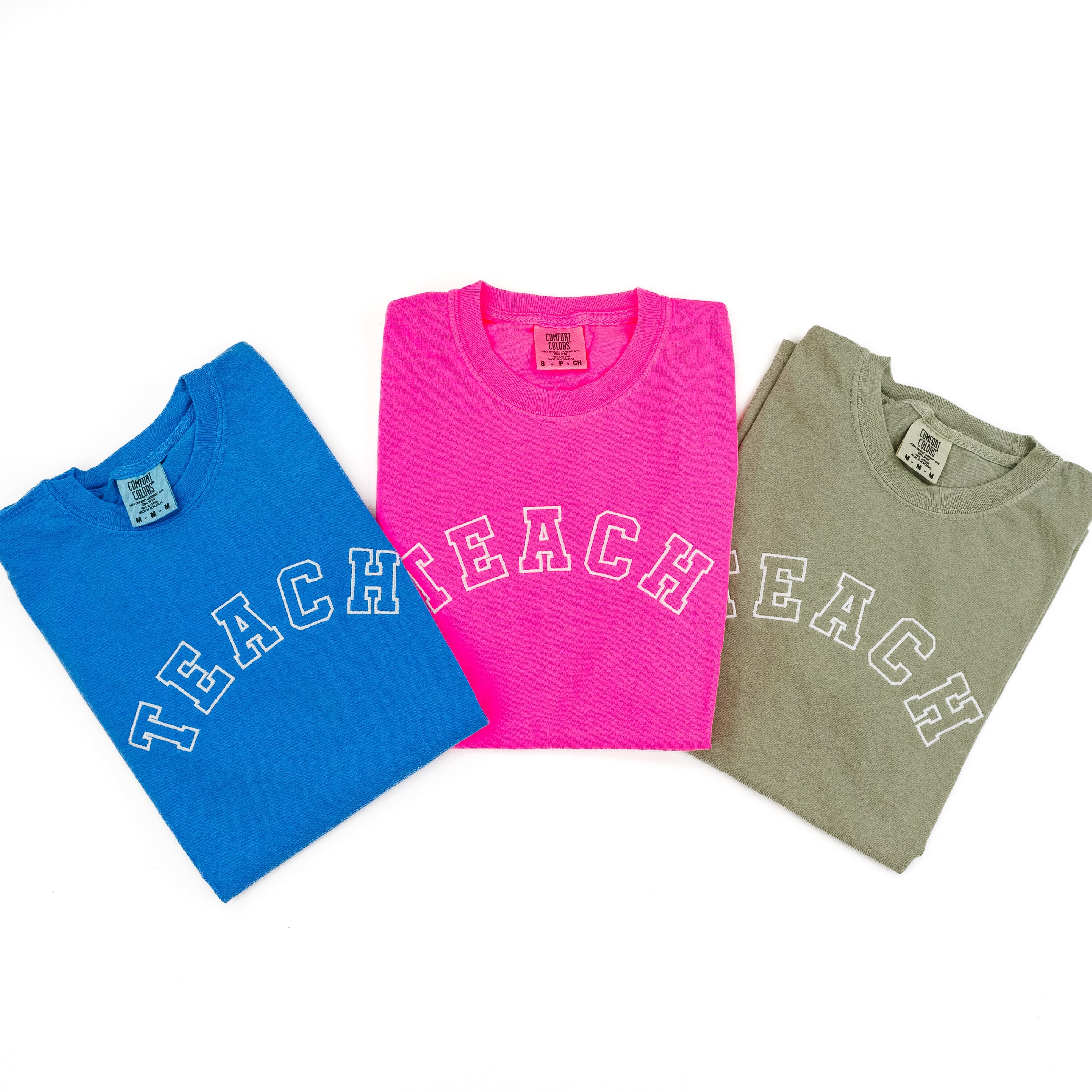 Embroidered Short Sleeve Comfort Colors Tee - TEACH - (Varsity Outline w/ White Thread) Little Mama Shirt Shop LLC