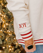 V neck sweater in white with red stripes on cuffs with embroidered 'JOY' embroidered on cuff, shown on model – Little Mama Shirt Shop